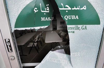 The Islamic Center of Cartersville near Merchants Square was vandalized Monday night when several glass doors were shattered. This is the second time in about three weeks the center has been vandalized. SKIP BUTLER/The Daily Tribune News The Islamic Center of Cartersville near Merchants Square was vandalized Monday night when several glass doors were shattered. This is the second time in about three weeks the center has been vandalized. SKIP BUTLER/The Daily Tribune News