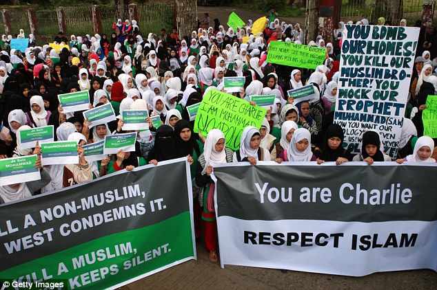 Outrage: Many Muslims believe their faith forbids depictions of the prophet and reacted with dismay - and occasionally anger - to the latest cover image including at this demonstration in Marawi in the Philippines