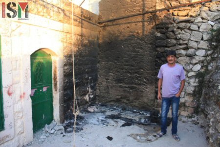 Imad Abu Shamsiyeh outside his home