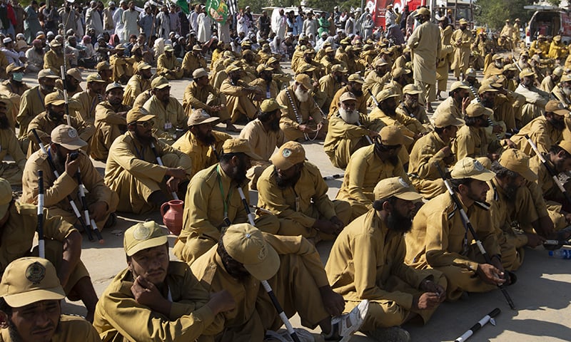 JUI-F activists listen to their leaders during the Azadi March on Monday.  AP